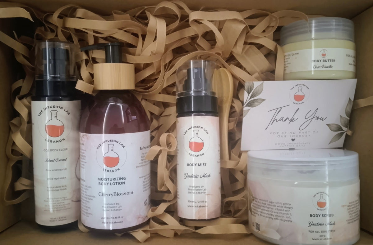 The Infusion Lab Body Set showing five products in mixed fragrance variants, arranged in a gift box